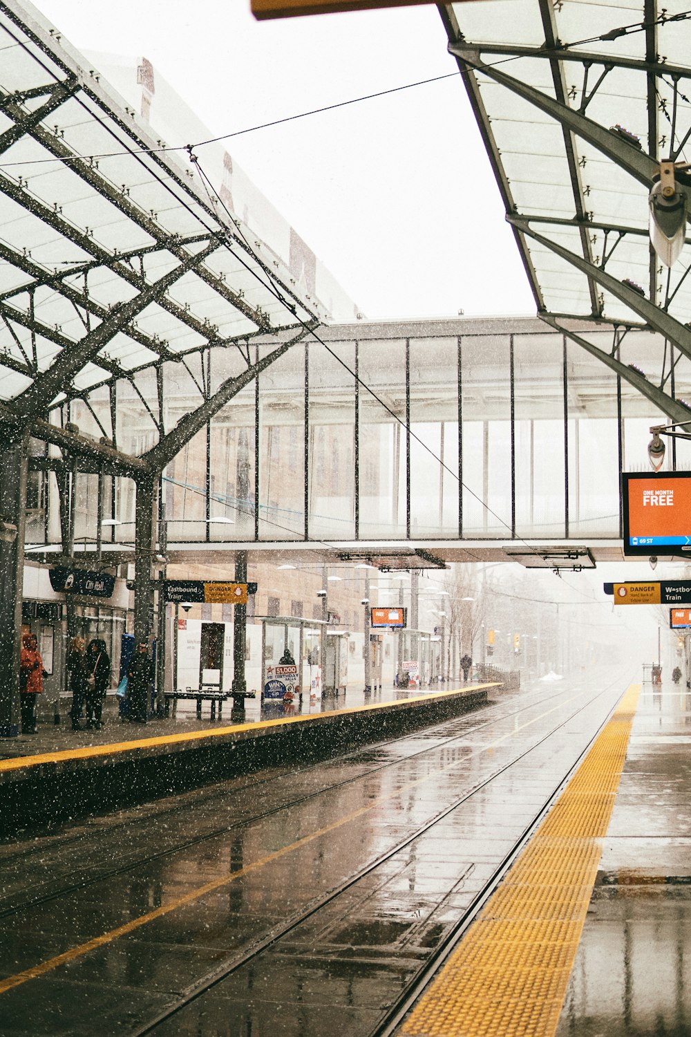 people standing on train station during daytime