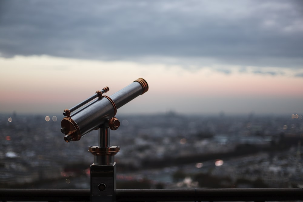 black telescope during day time