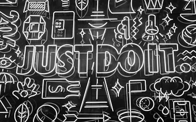 A neon sign of line-art icons