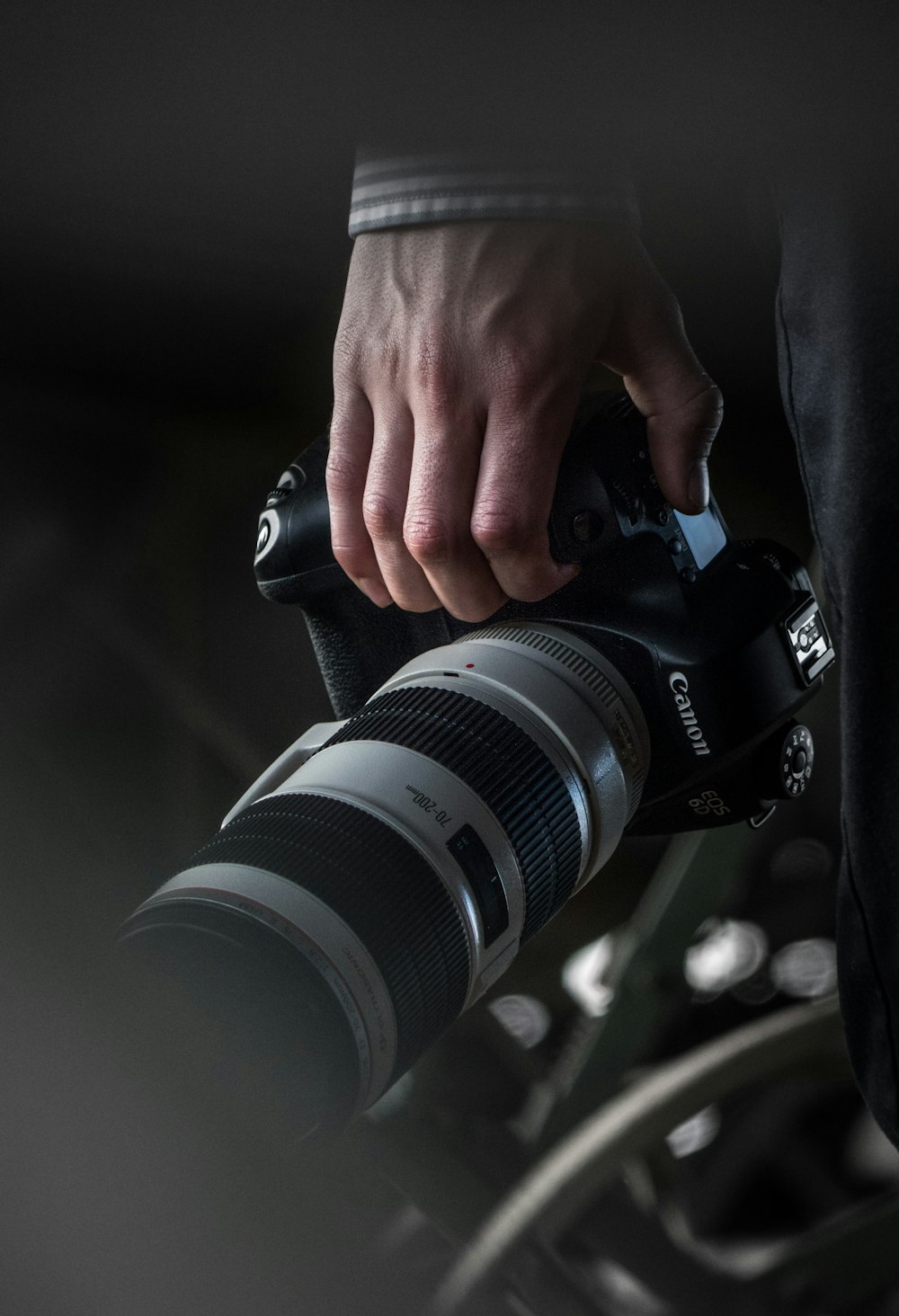 person holding black dslr camera