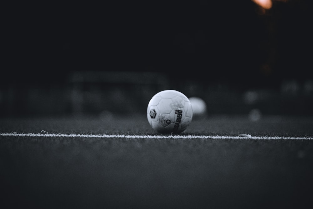 white soccer ball on field