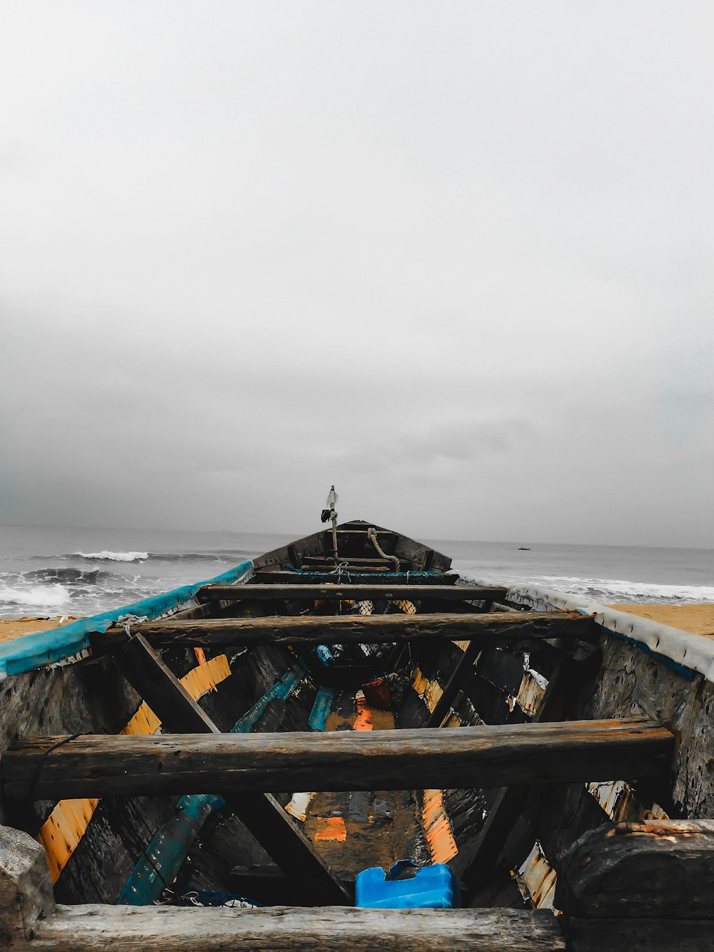 brown wooden boat on sea during daytime