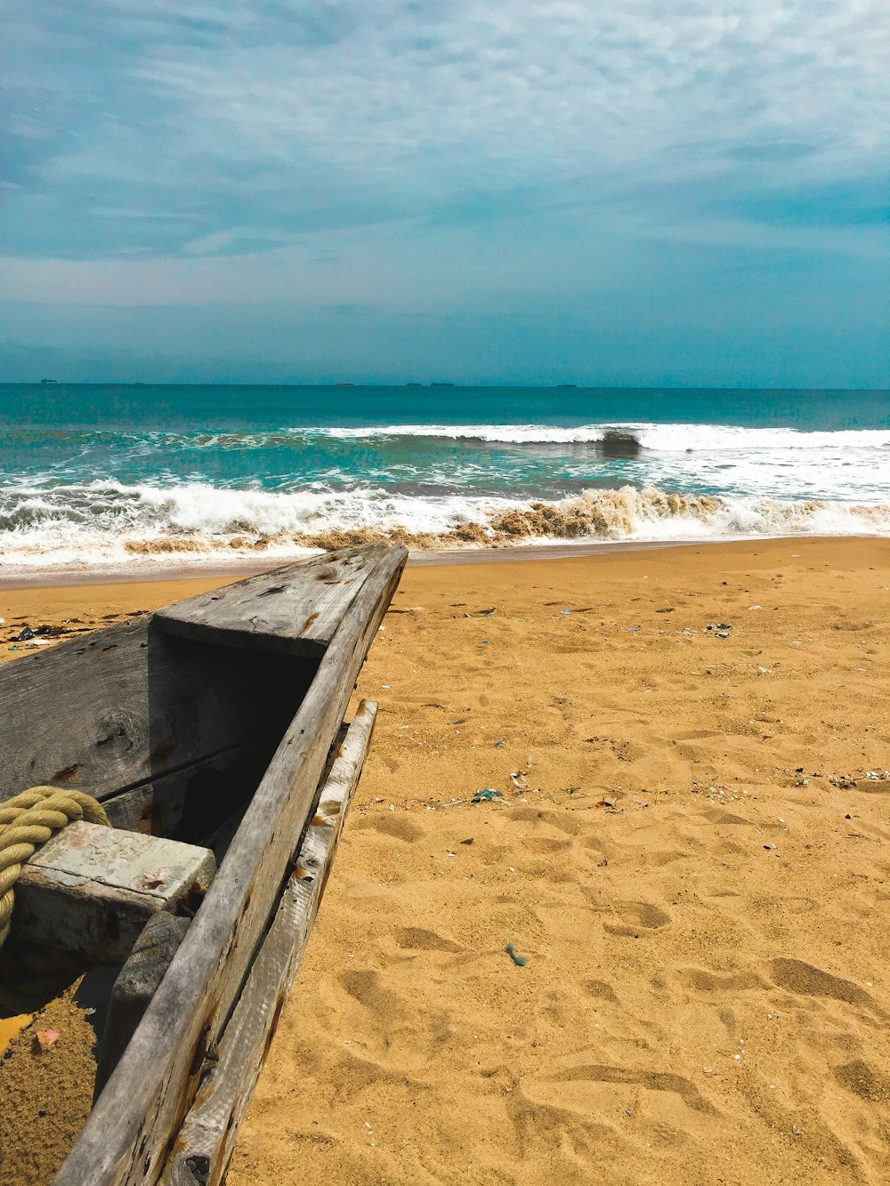 brown wooden boat on beach during daytime