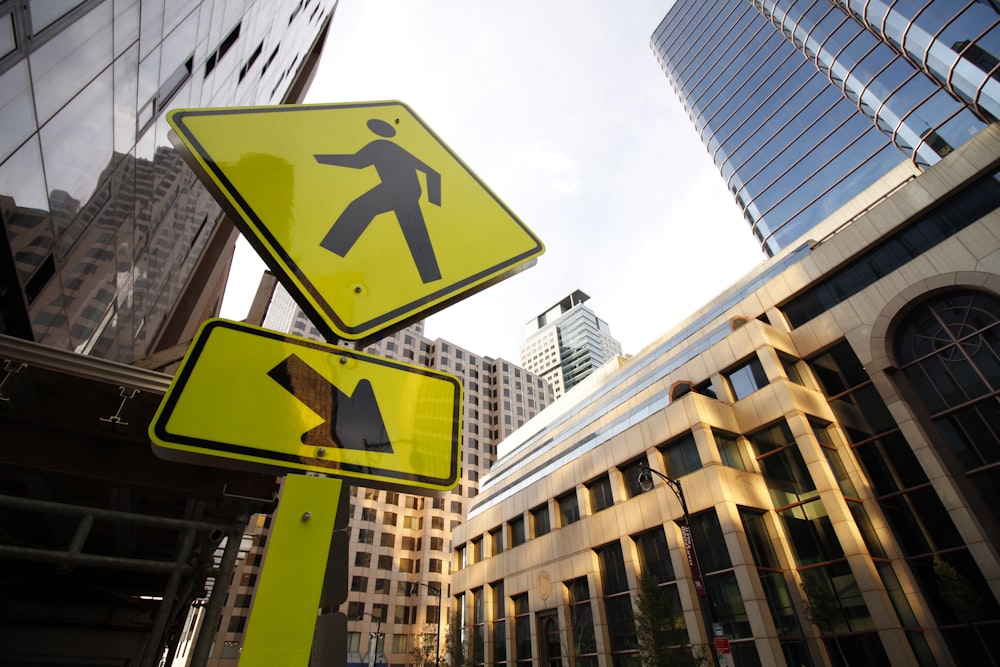 yellow and black pedestrian sign