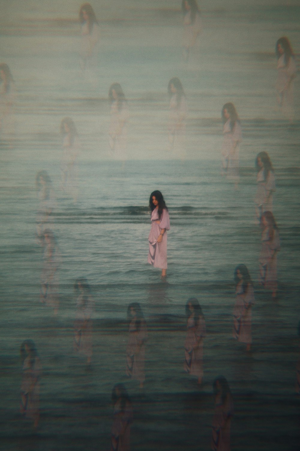 woman in white dress standing on water