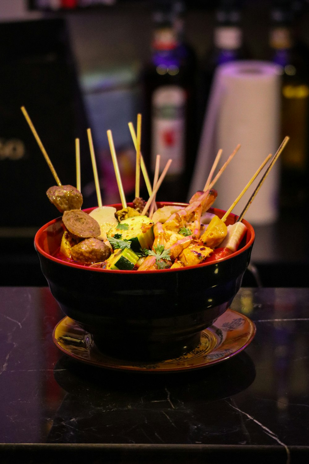 brown ceramic bowl with chopsticks