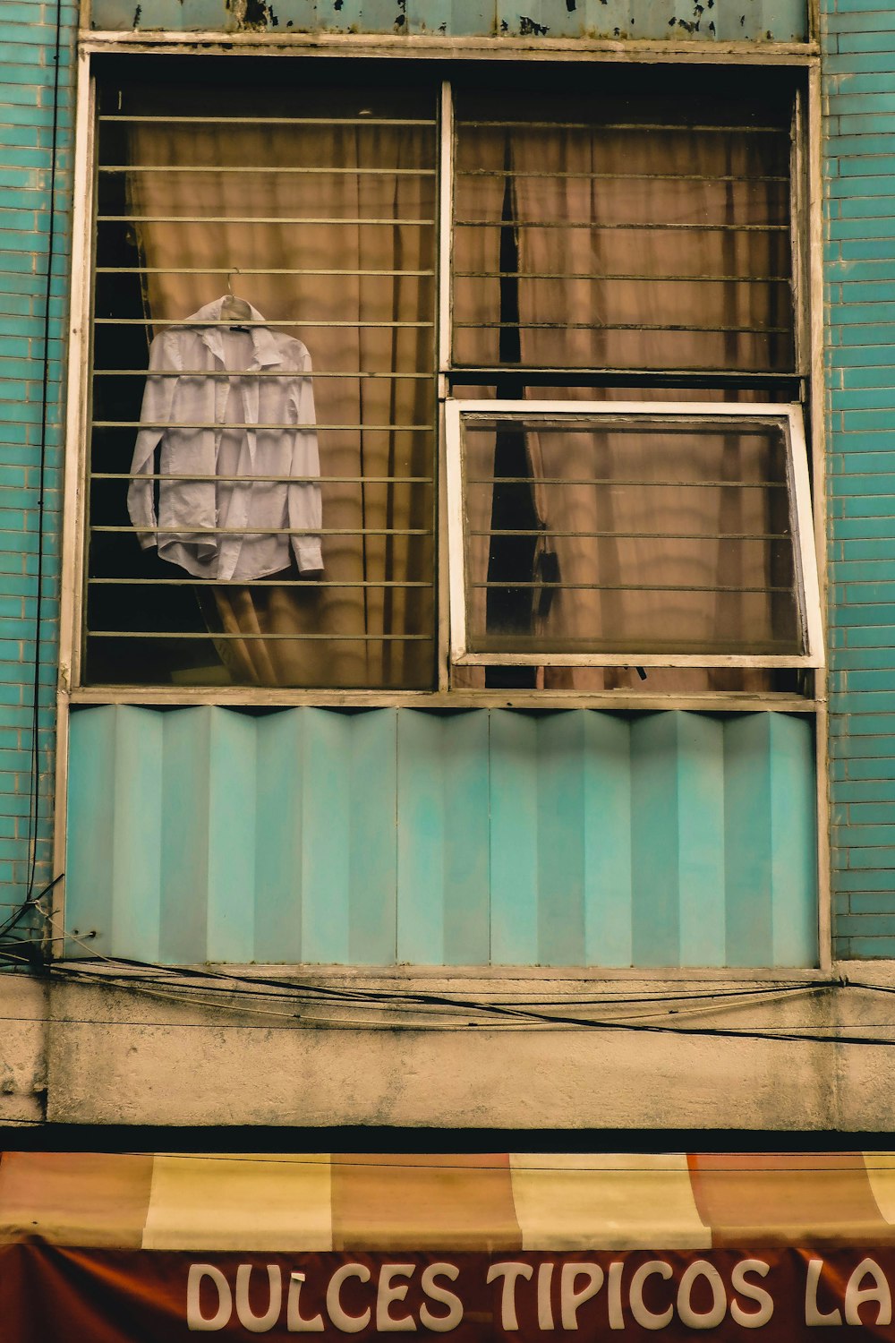 white and blue wooden window