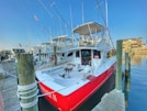 red and white boat on dock during daytime