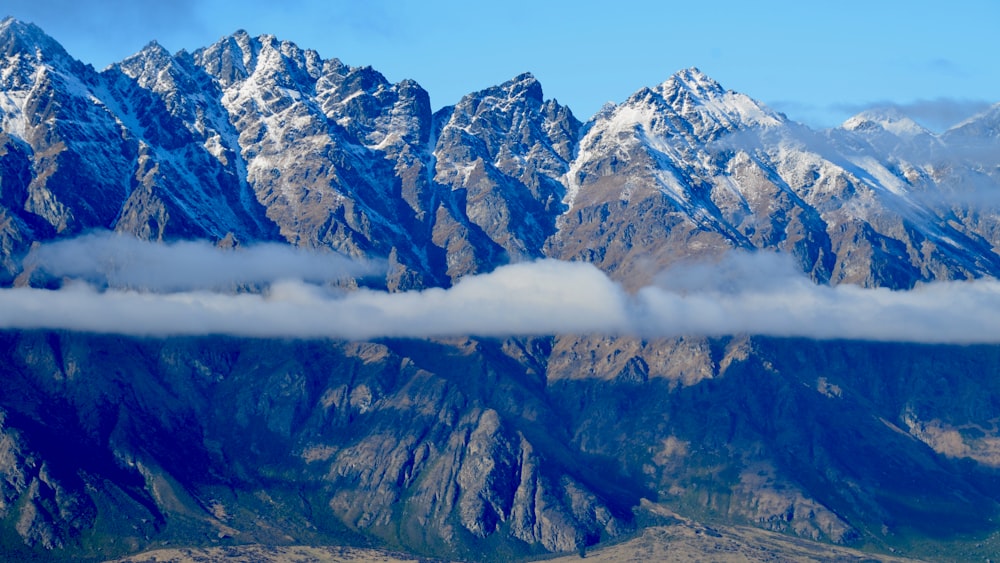 snow covered mountain under blue sky during daytime