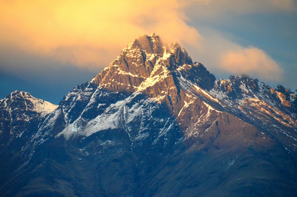 snow covered mountain during daytime