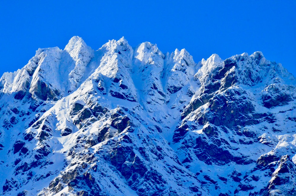 snow covered mountain under blue sky during daytime