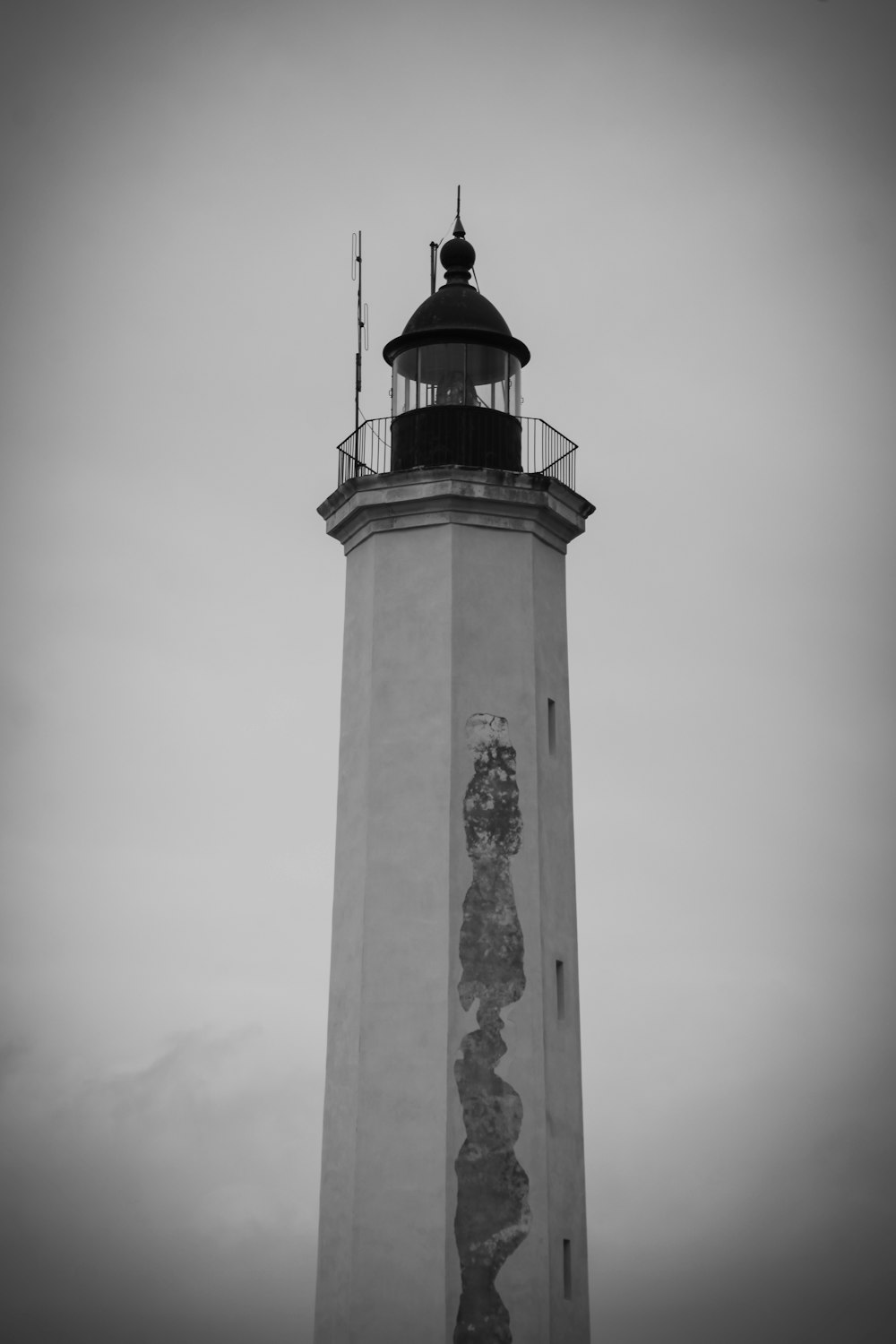 white and black concrete lighthouse