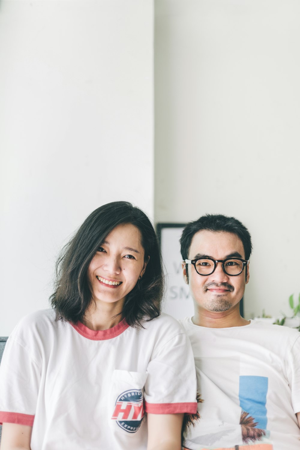 woman in white crew neck shirt beside woman in white crew neck shirt