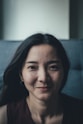 woman in black shirt smiling