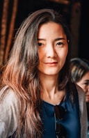 woman in gray and blue shirt