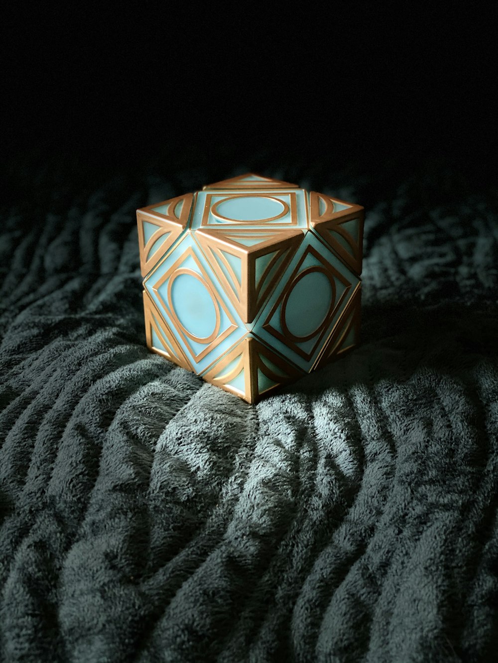 orange and white box on gray textile