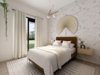 A cozy bedroom showcasing modern decor and textiles.