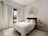 A stylish bedroom featuring lushlove's aesthetic accents.