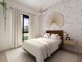 A modern and cozy bedroom with a large bed placed against a wall adorned with a nature-themed wallpaper. The bed is made with white linens and accentuated with patterned pillows and a beige throw. On either side of the bed are wooden floating nightstands with matching gold lamps. Above the bed hangs a unique, fan-shaped wall decor piece. The room features a large window with white curtains, allowing natural light to flood in, complemented by a geometric-patterned rug on a light wooden floor. A stylish pendant light hangs from the ceiling, and a hanging plant is seen on the left side, adding a touch of greenery to the serene atmosphere.