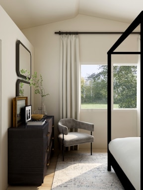 white and gray sofa chair near glass window