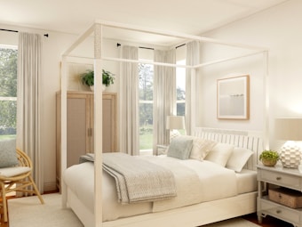 white bed near glass window