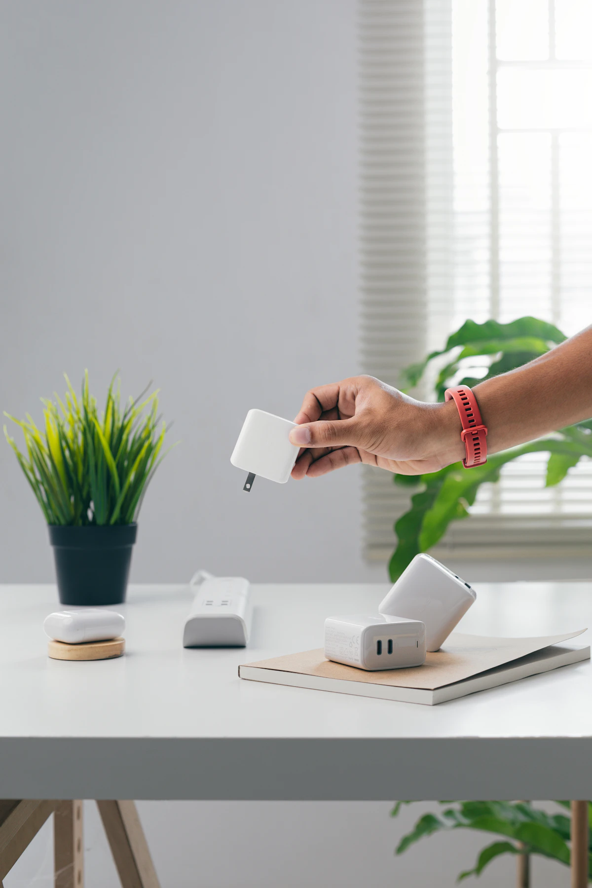 Power bank charging a smartphone on a desk