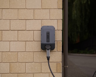 black charger plugged in on socket