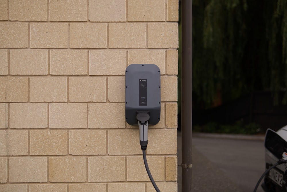 black charger plugged in on socket