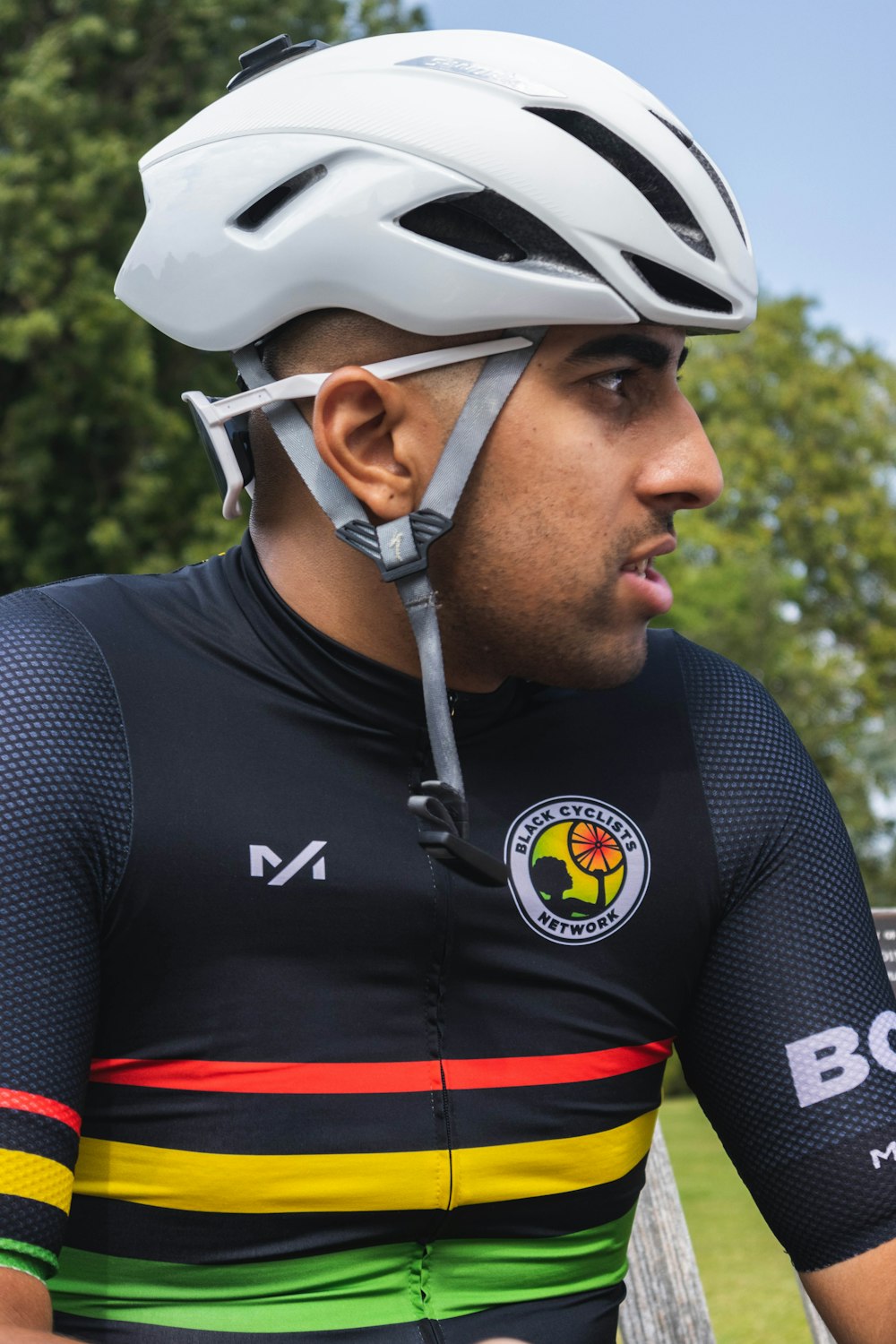 man in black and red jersey shirt wearing white helmet