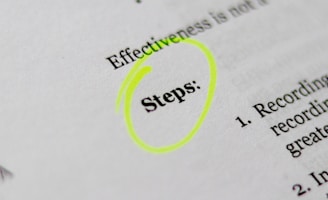 A close-up of a printed document with the word 'Steps' highlighted in bright yellow. The text appears to be part of a list or instructions, noted by the numbered points visible on the right.