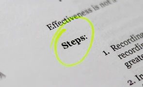 Close-up of a collapsible exercise card expanding to reveal detailed workout steps.