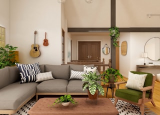 white and black sofa near brown wooden coffee table