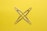yellow paper clip on yellow surface