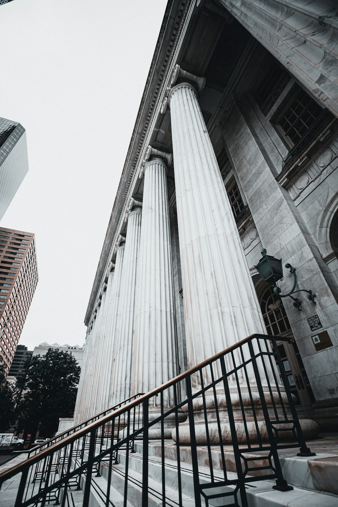 people walking on stairs near high rise buildings during daytime