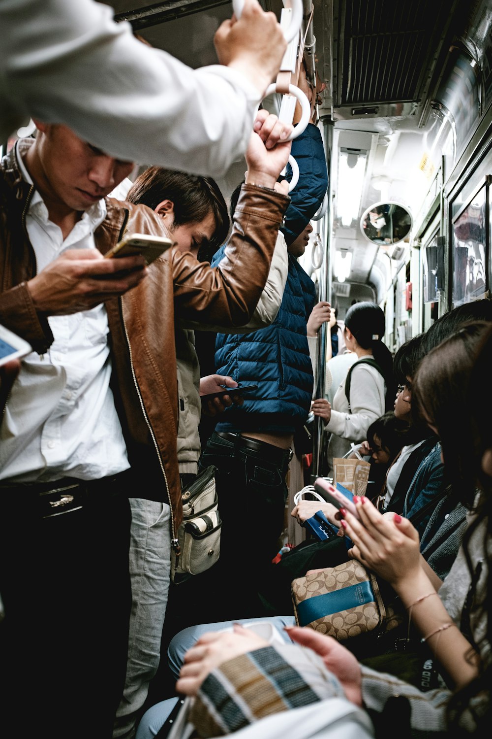 man in white dress shirt and brown vest