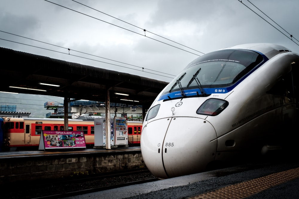 white train on train station during daytime