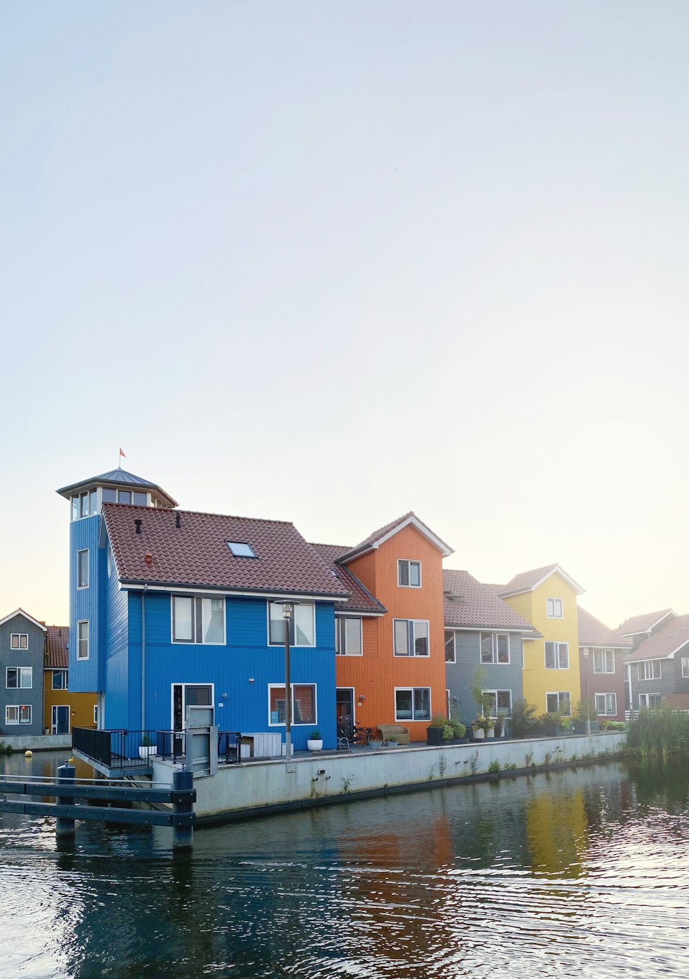 houses near body of water during daytime