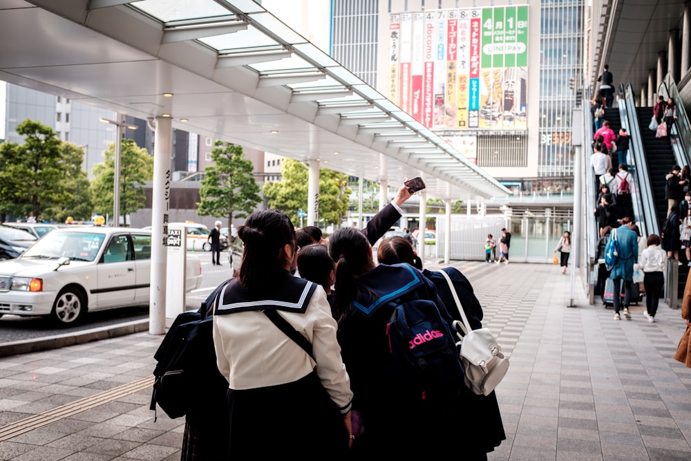 people walking on sidewalk during daytime