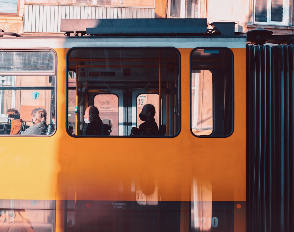 people in train during daytime