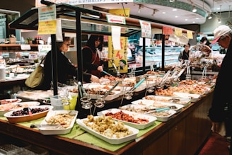 people sitting on chair in front of table with foods