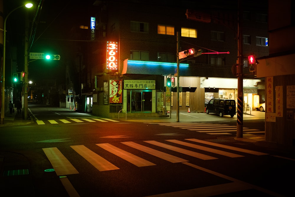 red and white pedestrian lane during night time