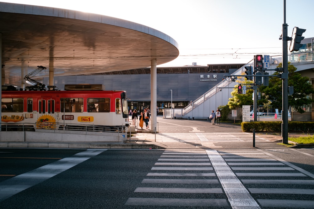 white and red train on train station during daytime