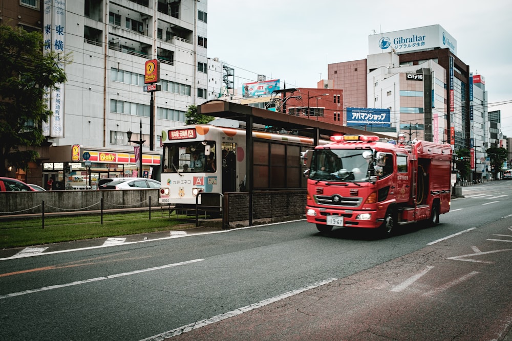 red and white bus on road during daytime