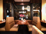 Custom-dyed curtains in brand colors adorning a boutique restaurant’s private booth.