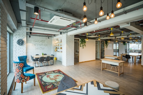 brown wooden table with chairsby myHQ Workspaces