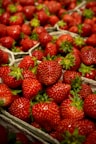strawberries on clear glass bowl