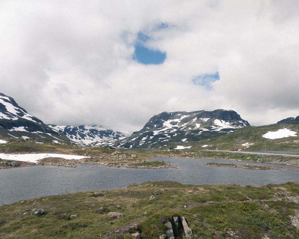 snow covered mountain under cloudy sky during daytime