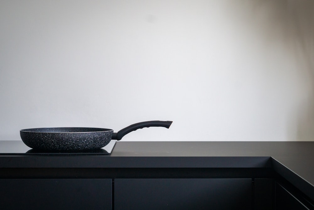 black leather chair on black wooden table