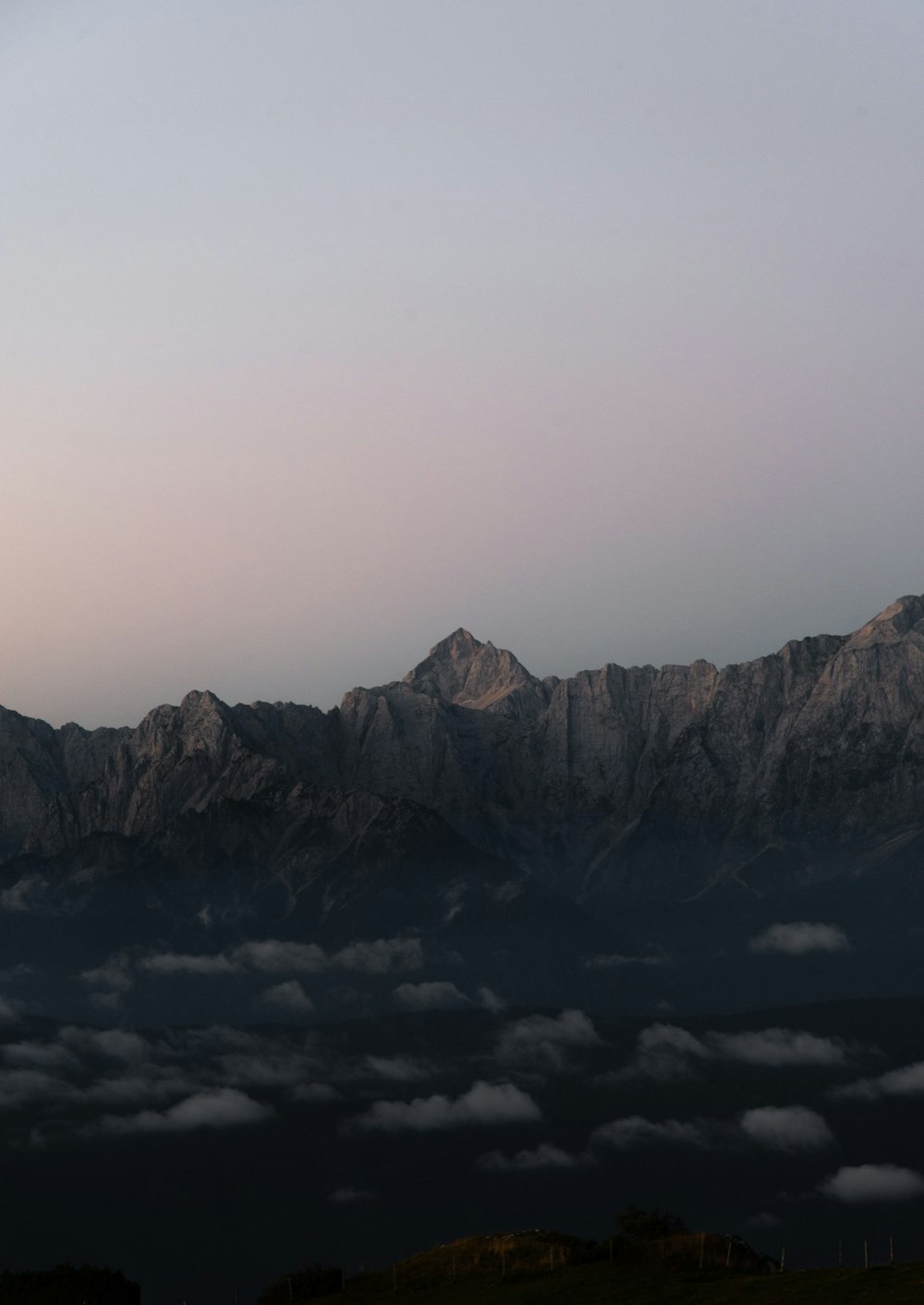 gray rocky mountain under white sky during daytime