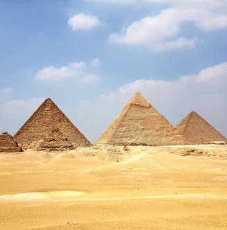 brown pyramid under blue sky during daytime